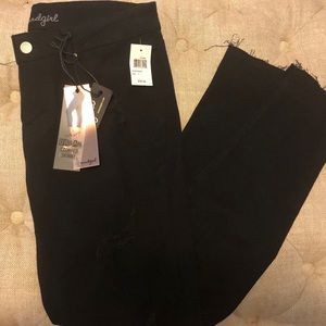 Women’s black distressed jeans